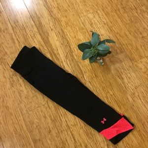 Pink and black Under Armor crops